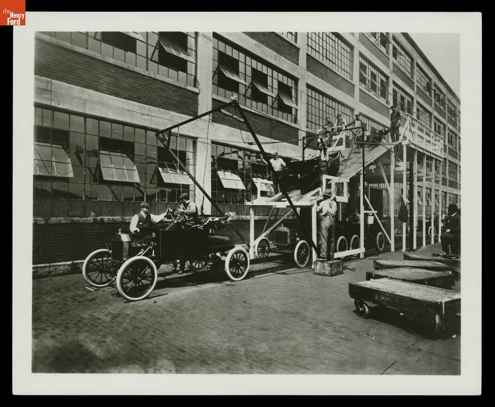 An old photograph showing a Ford Model T assembly line.